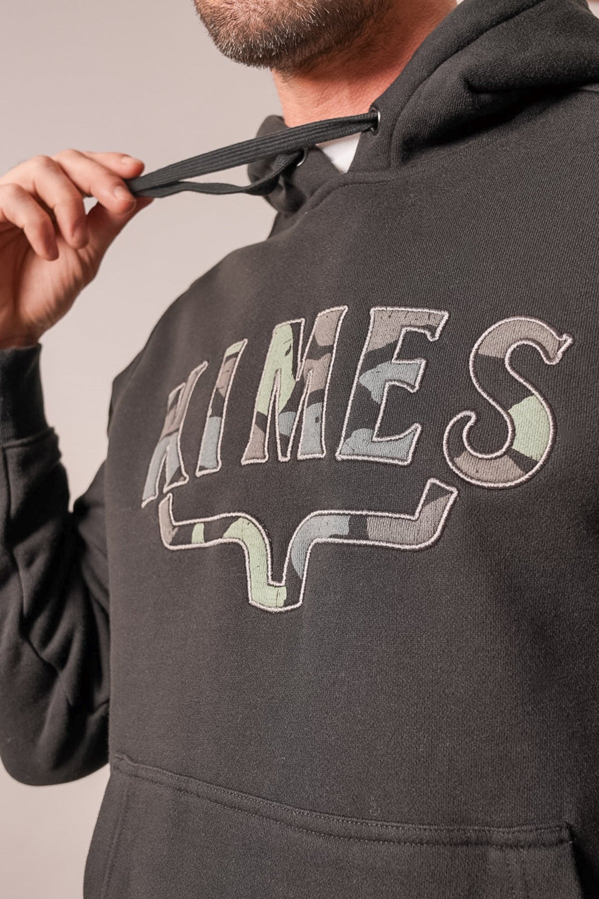 Kimes Ranch Riddle hoodie in black with a camo-patterned "KIMES" graphic and logo on the front
