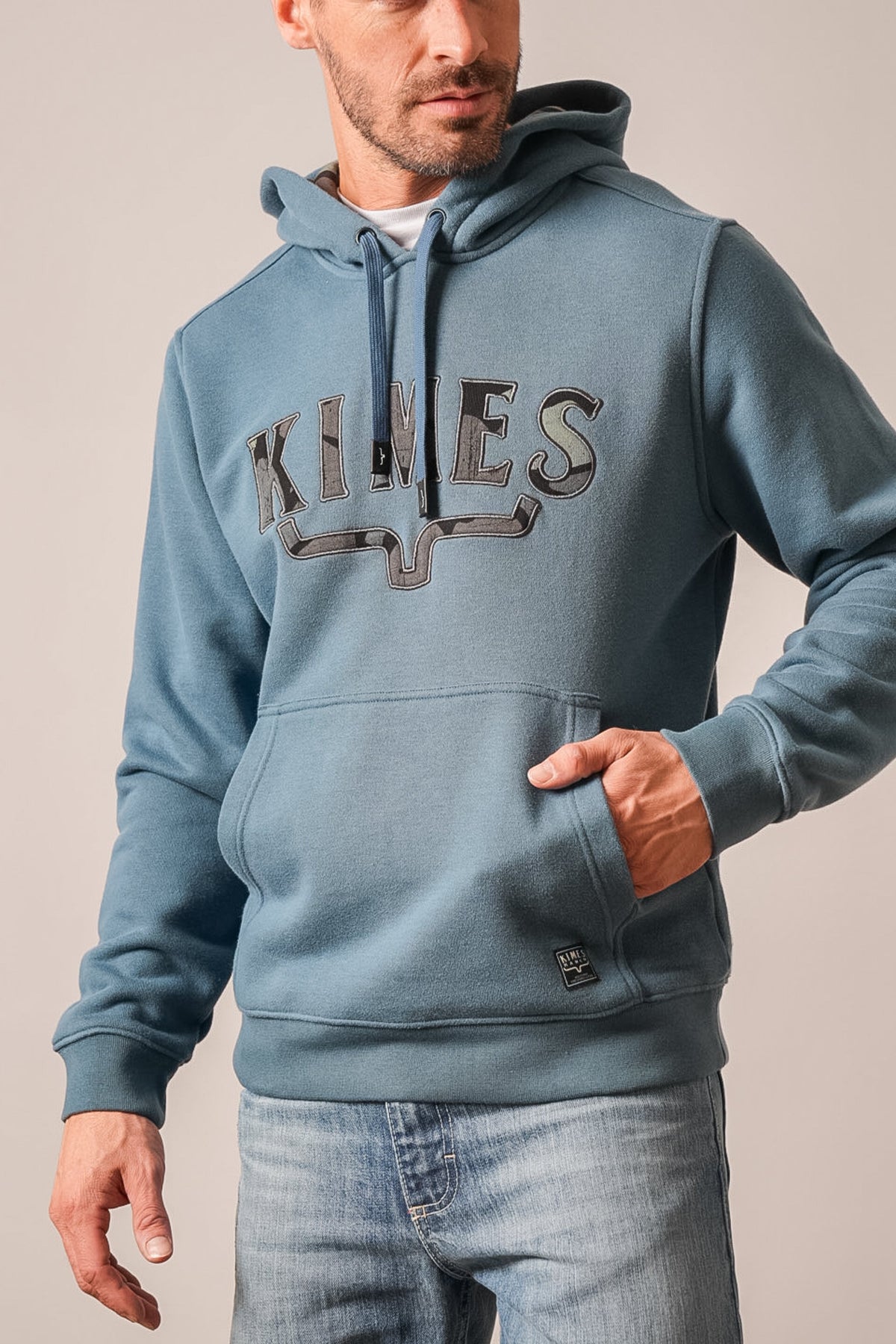 Kimes Ranch Riddle hoodie in dark blue with a KIMES graphic across the chest and front kangaroo pocket