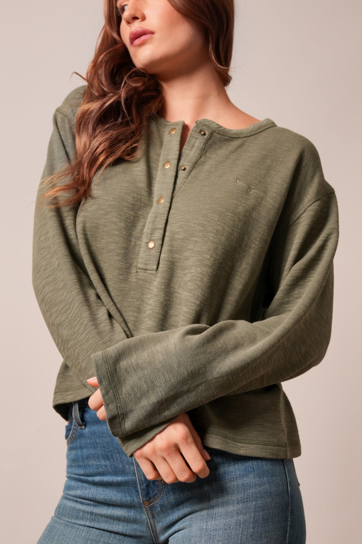 Kimes Ranch Sidney long sleeve henley top in moss with a button placket and Kimes Ranch logo on the chest
