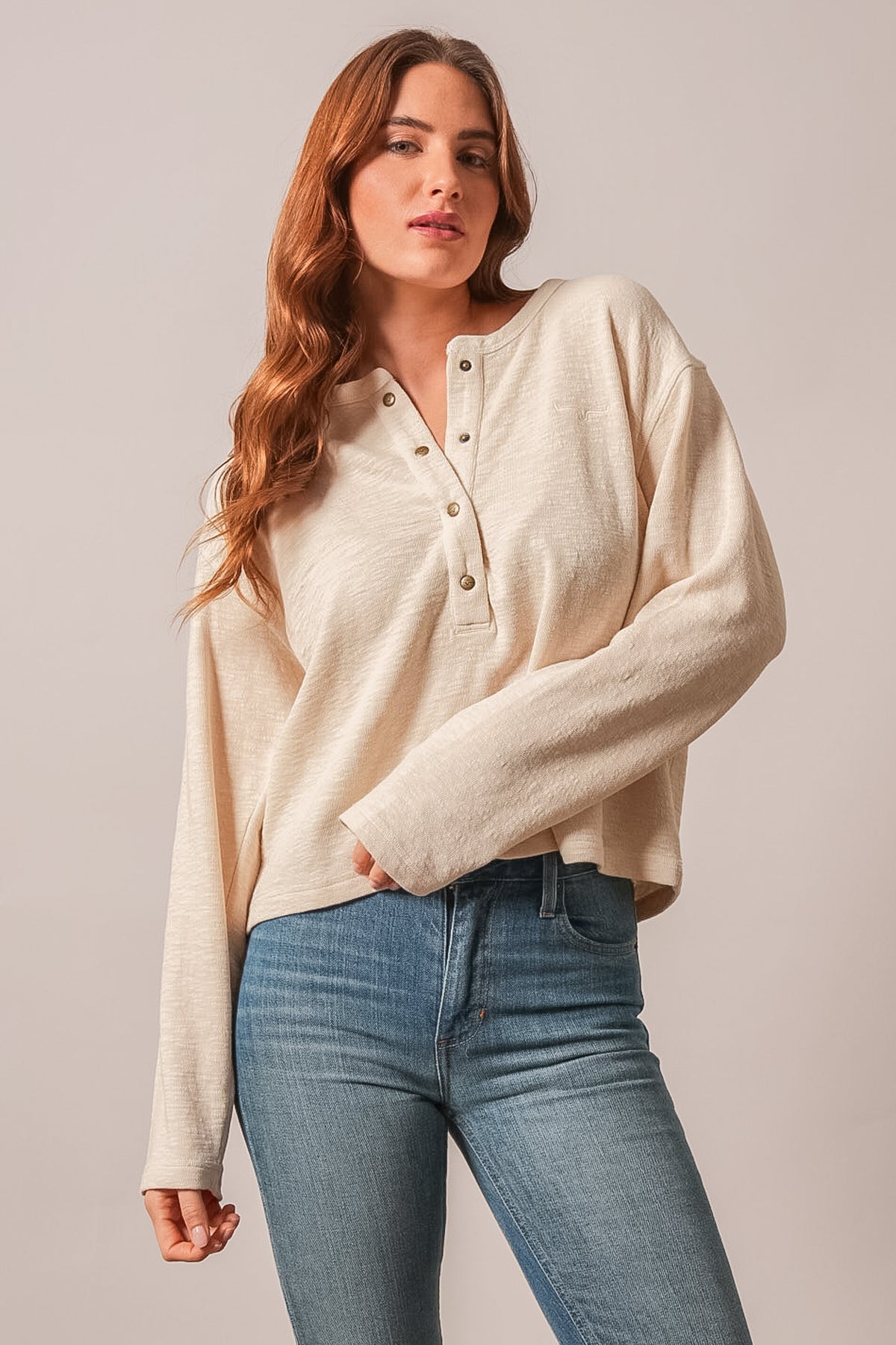 Kimes Ranch Sidney long sleeve henley top in natural with brass-tone buttons and embroidered Kimes Ranch logo on chest