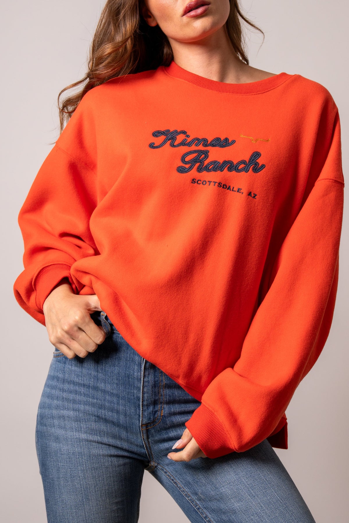 Kimes Ranch Solana sweatshirt in Fire with crewneck, long sleeves, and navy Kimes Ranch logo with SCOTTSDALE, AZ text