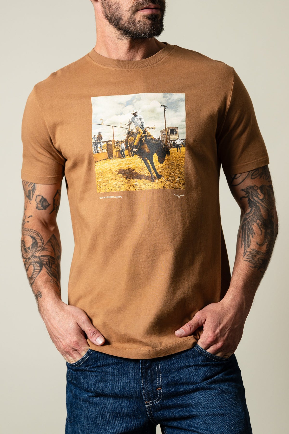 Kimes Ranch SS Classic Event shirt in Tobacco color with graphic of rodeo rider and "Scott Slusher Photography" text