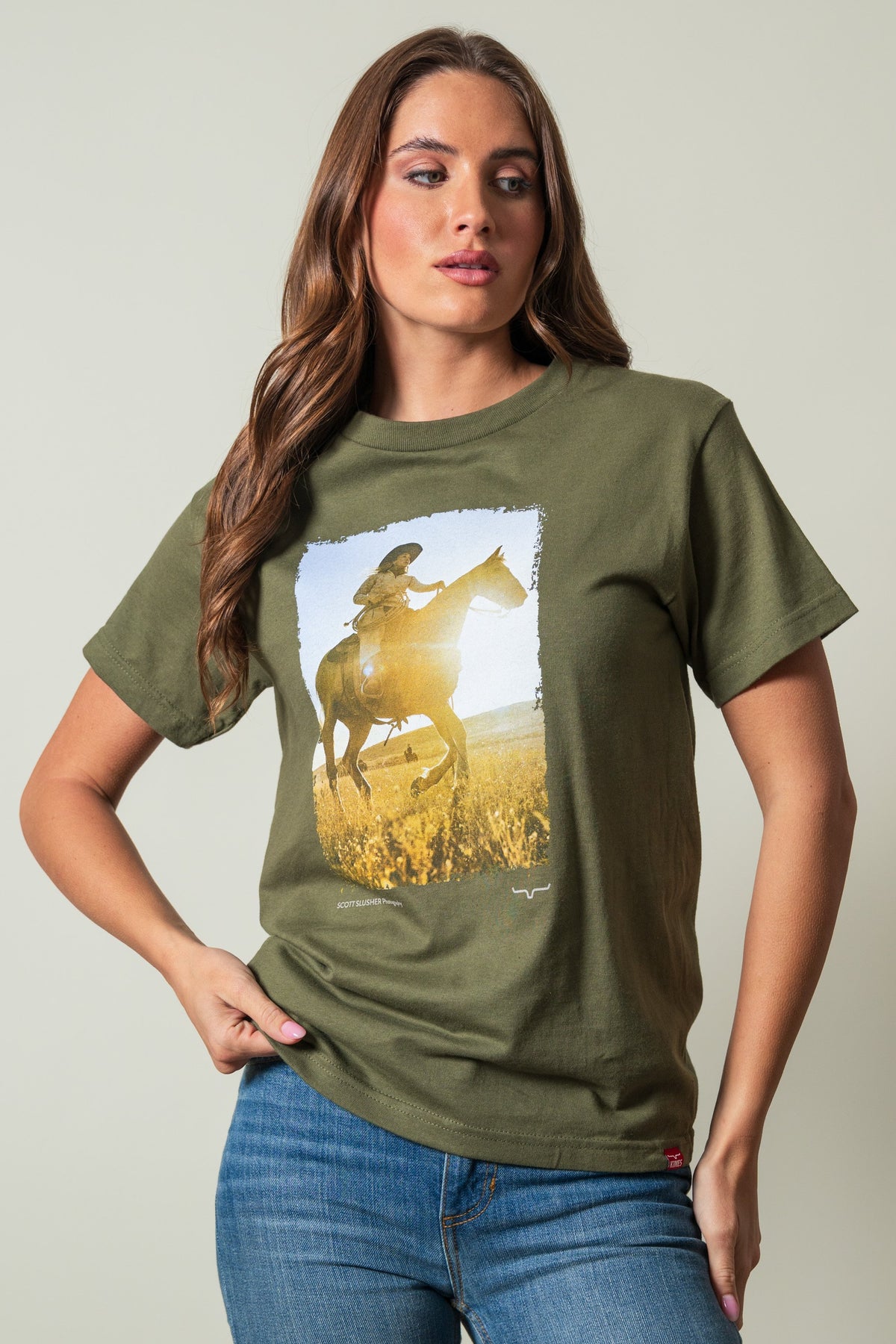 Kimes Ranch SS Riding Sunshine shirt in military green featuring a photo print of a rider on a horse in a field