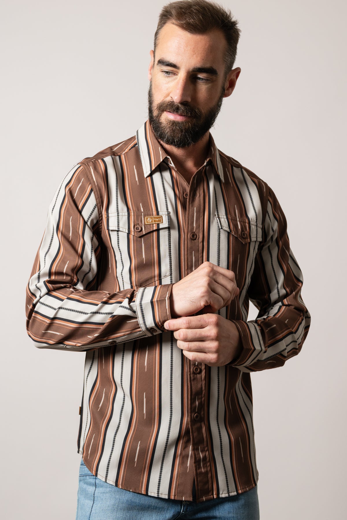 Kimes Ranch ZT Hickory long-sleeve brown dress shirt with multi-colored vertical stripes and front pockets