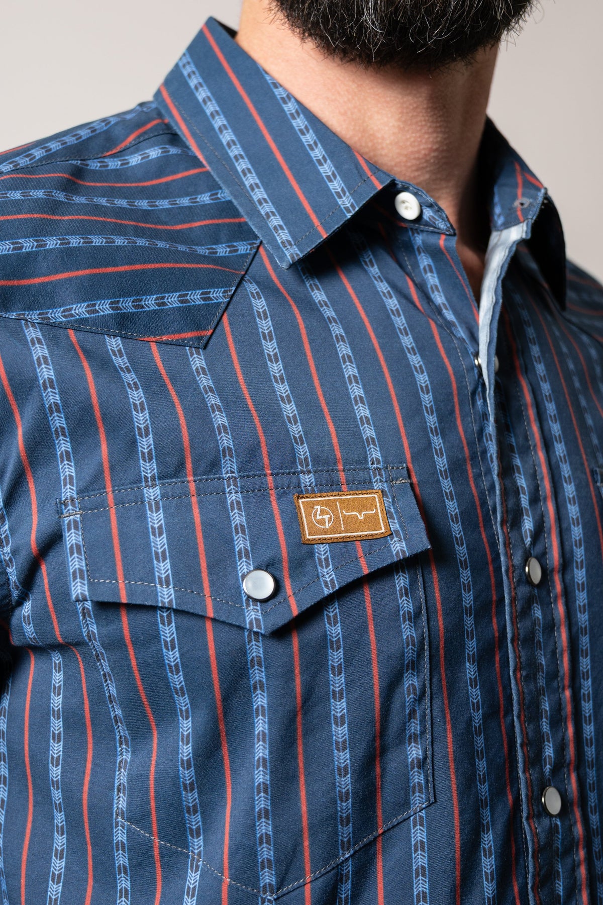 Kimes Ranch ZT Solano dark blue dress shirt with red and blue arrow print, two-button chest pocket with leather logo patch