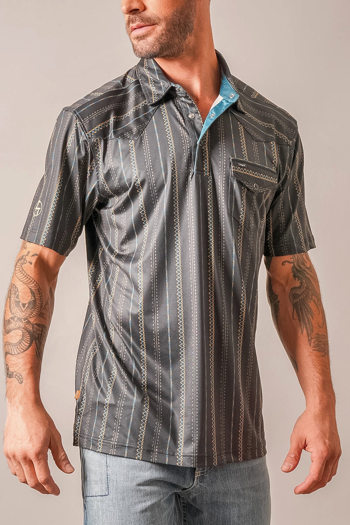 Kimes Ranch ZT Z-Stripe polo in Black with vertical zigzag stripes and a contrasting blue inner collar