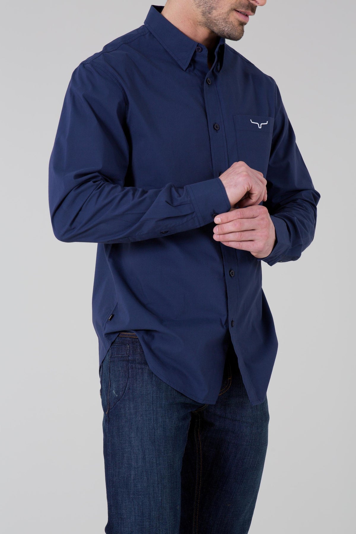 Kimes Ranch KR Team Dress Shirt in Navy, side view, with long sleeves and the Kimes Ranch logo on the chest pocket