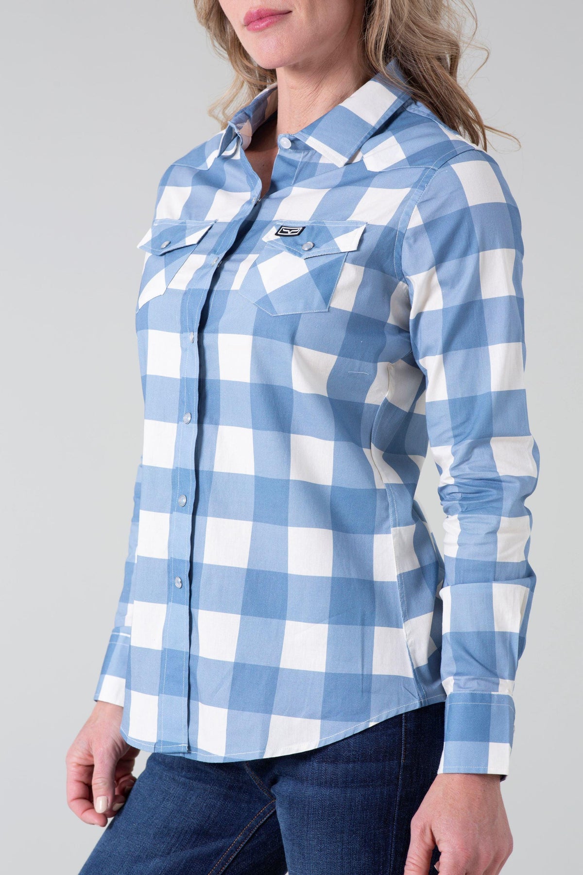Kimes Ranch Ladies Malcom Buffalo Plaid top in Blue, side view, with chest pockets and a logo patch