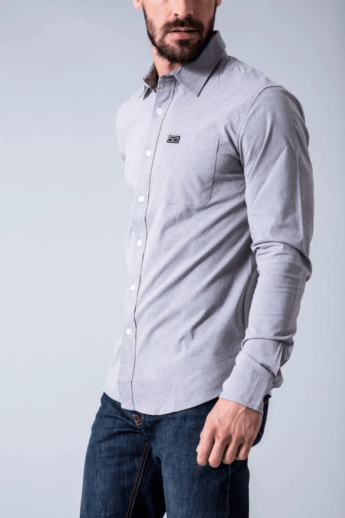 Kimes Ranch Linville Long Sleeve Dress Shirt in Grey Heather, side view, with a chest pocket and logo