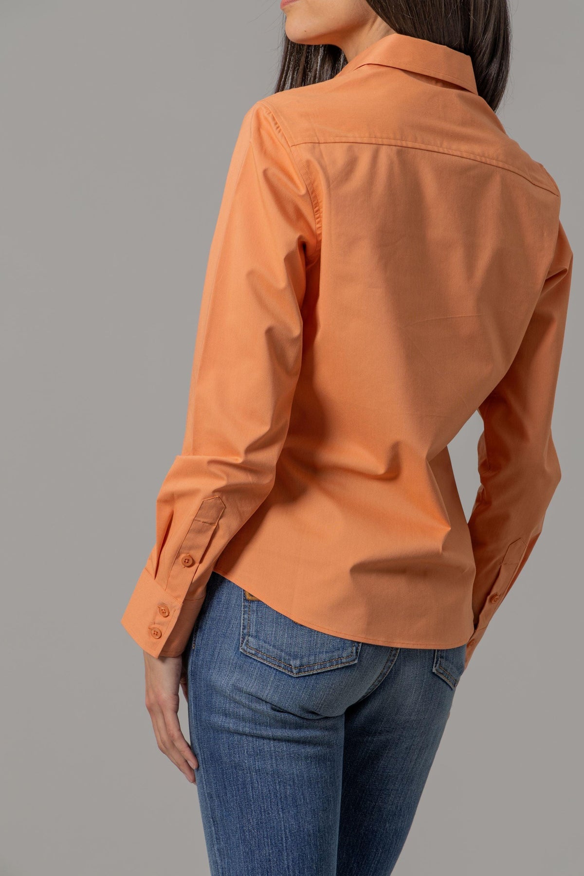 Kimes Ranch Ladies Linville top in Melon, back view, with a back yoke and buttoned sleeve cuffs
