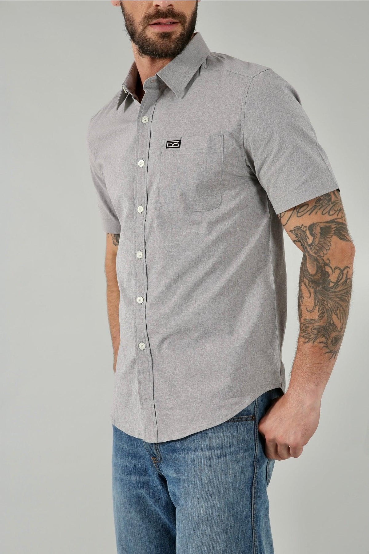 Kimes Ranch Linville Short Sleeve Dress Shirt in Grey Heather, side view, with a chest pocket and logo patch