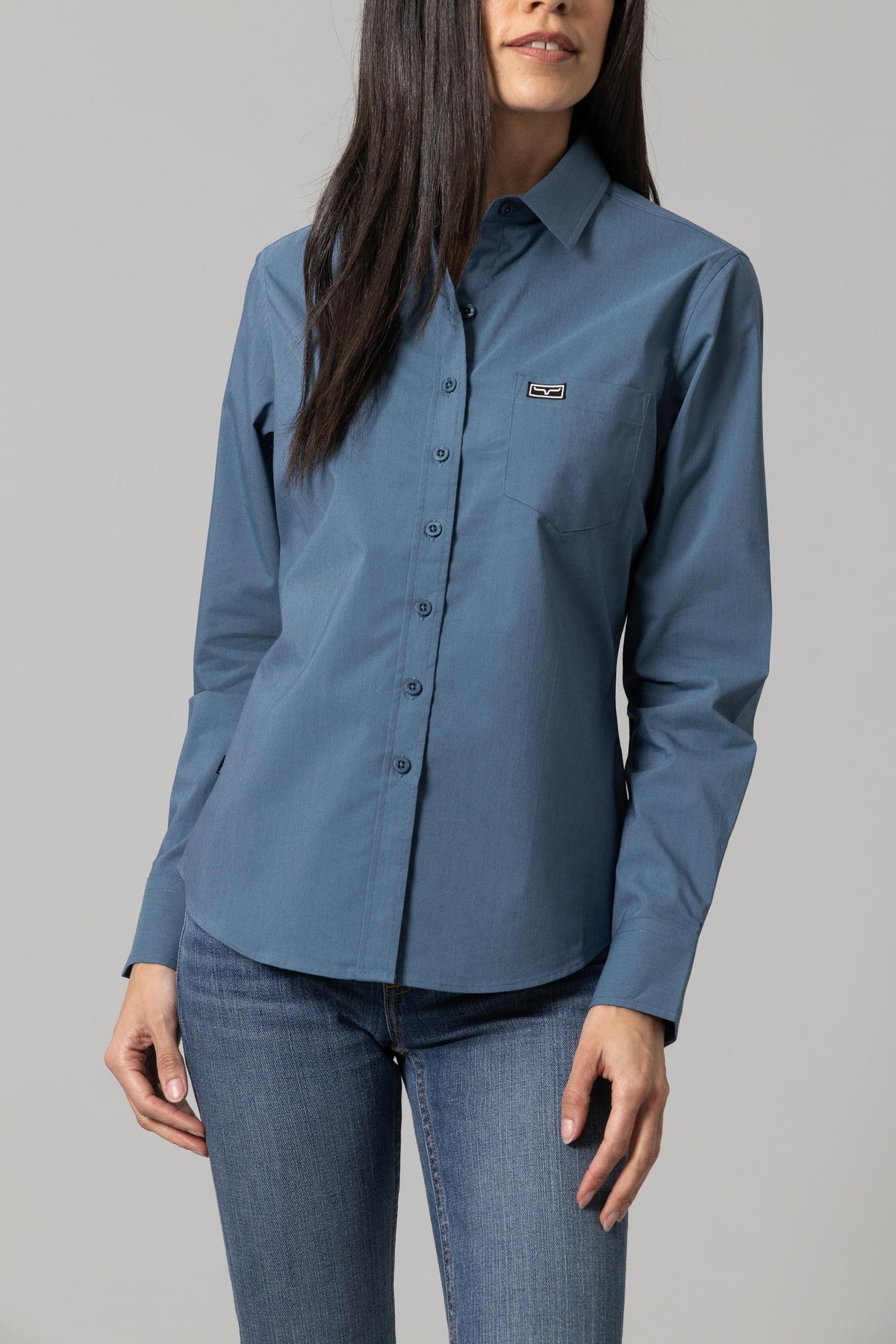 Kimes Ranch Ladies Linville top in Slate Blue with a button front and chest pocket with logo