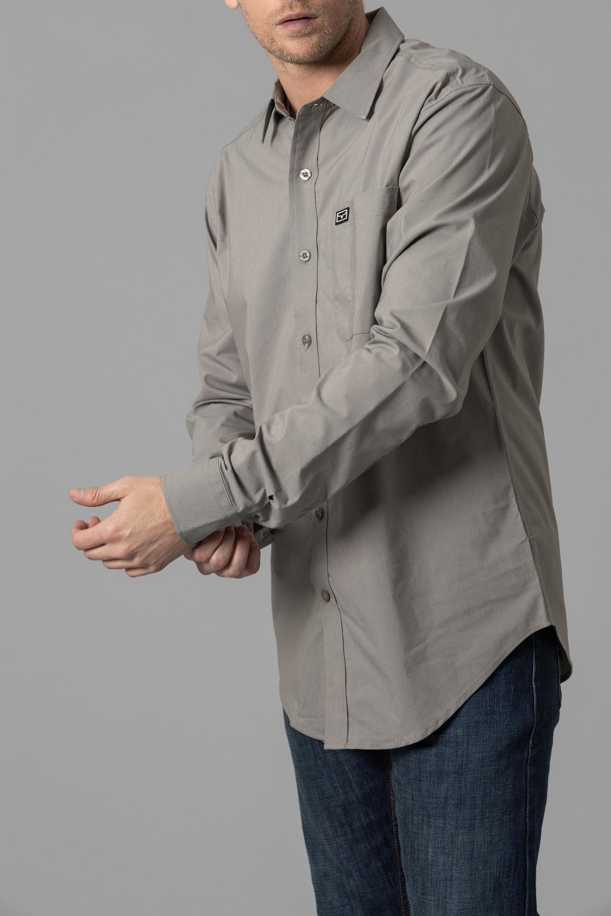 Kimes Ranch Linville Long Sleeve Dress Shirt in Sage, side view, with a button front, collar, and chest pocket with logo