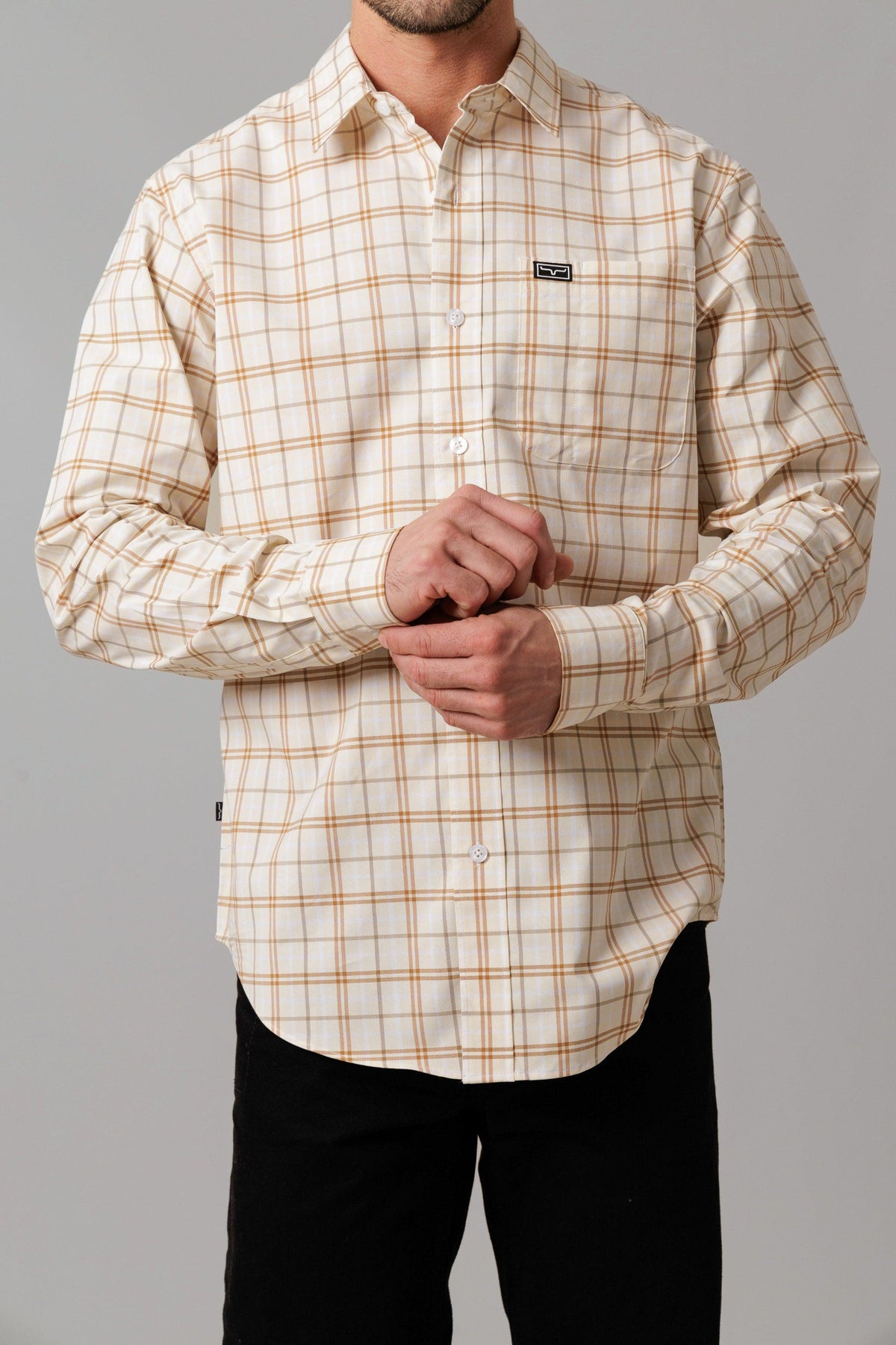 Kimes Ranch Lucas dress shirt in Natural with a brown plaid pattern and a chest pocket with the Kimes Ranch logo