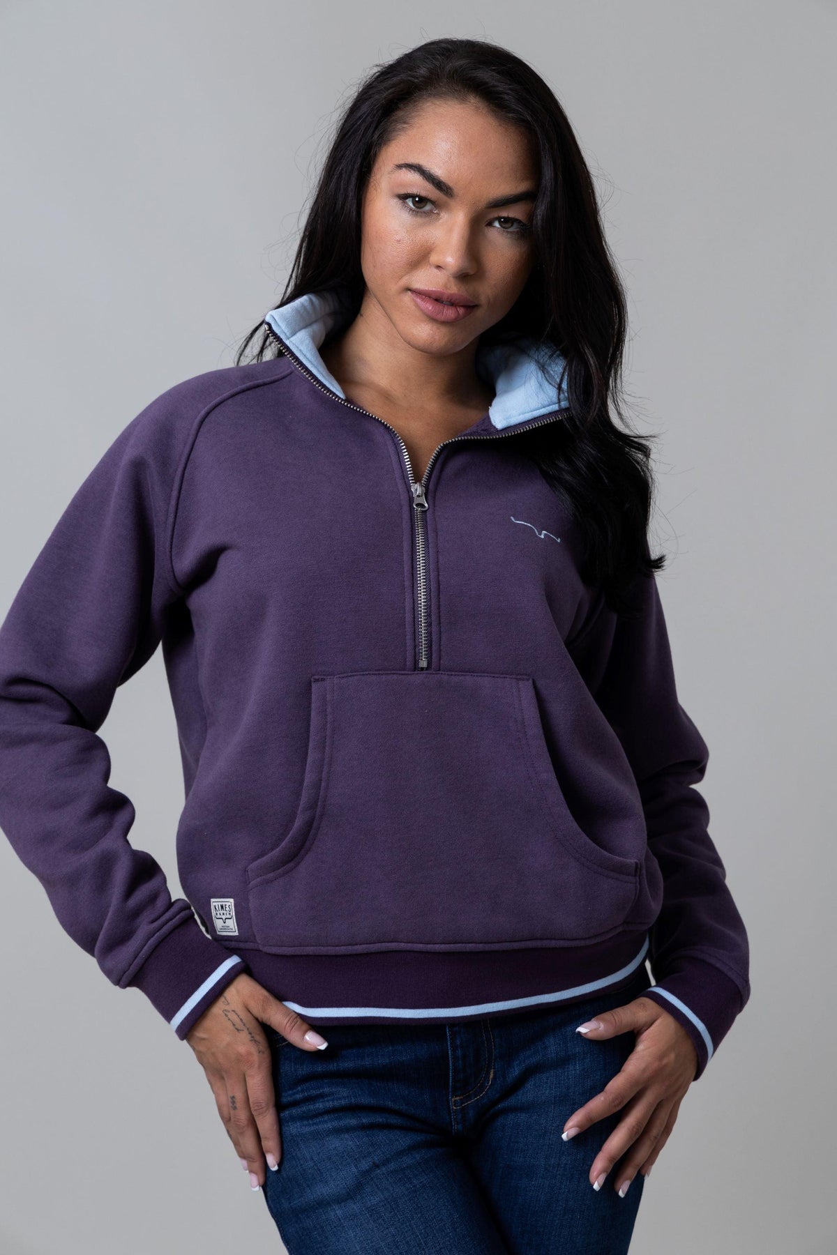 Kimes Ranch Malta Cropped Quarter Zip Sweatshirt in Plum with a front kangaroo pocket and light blue contrast trim