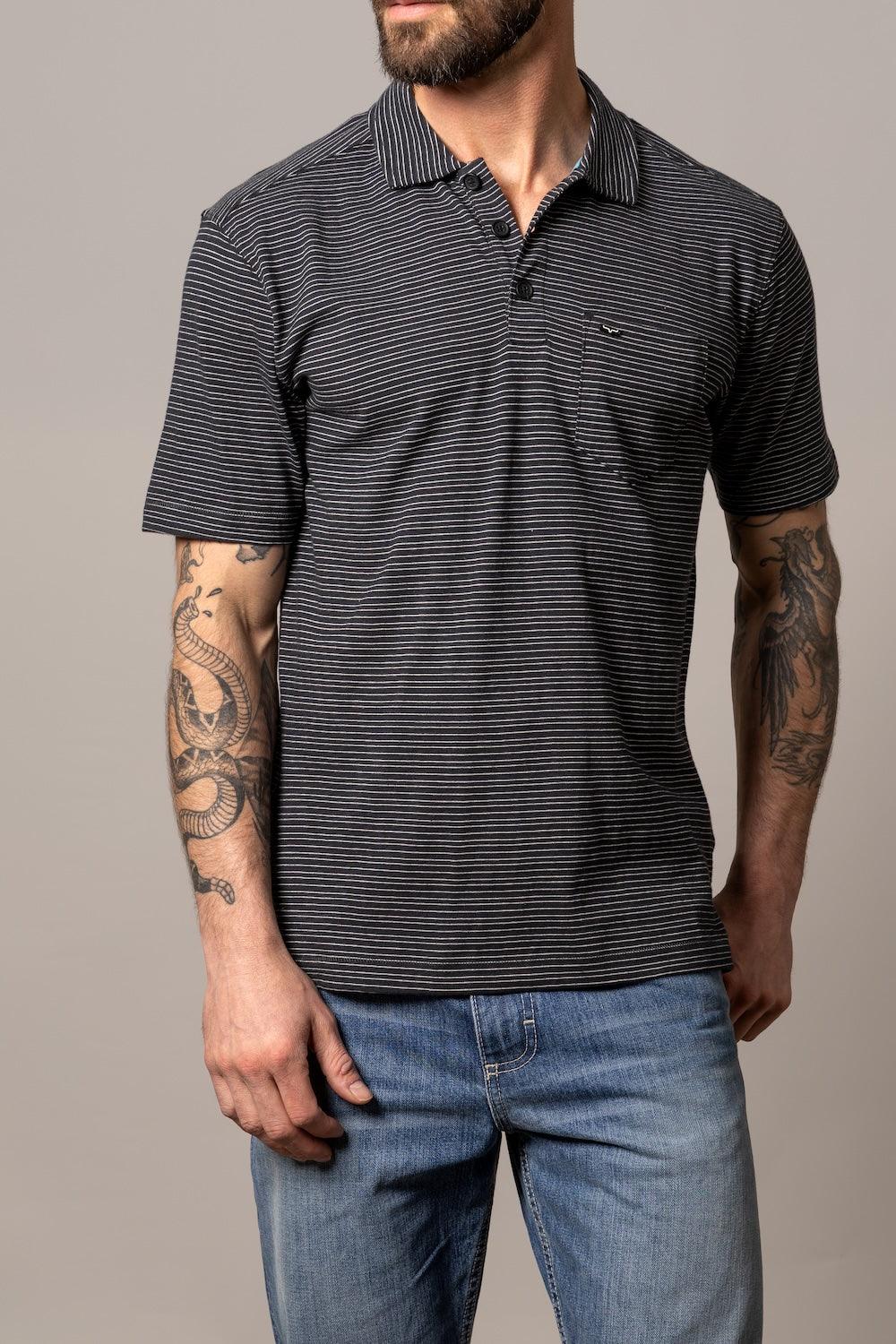Kimes Ranch Harlan Polo in Black with white horizontal stripes, short sleeves, and a chest pocket with the Kimes Ranch logo