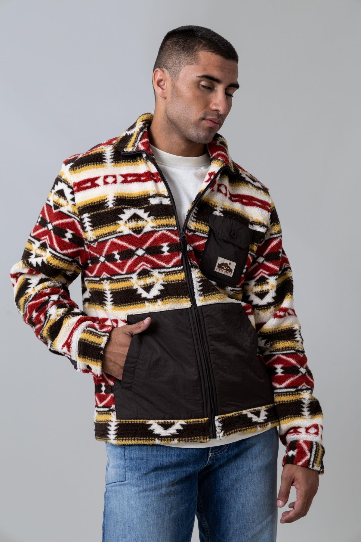 Kimes Ranch Maxwell sweatshirt in Brown with a multicolor geometric pattern and a front pocket with the Kimes Ranch logo