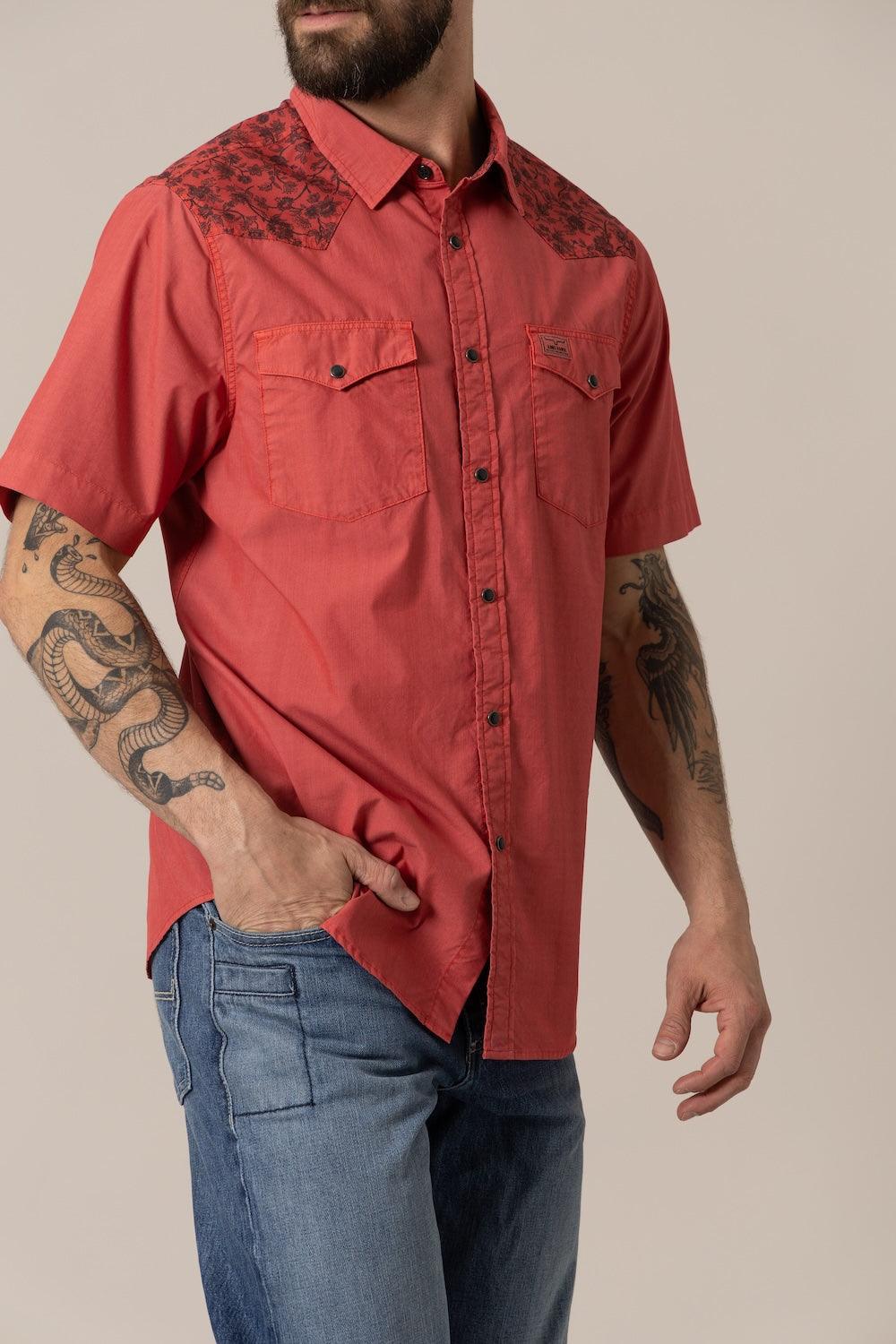 Kimes Ranch Medina Red short sleeve dress shirt with two button flap chest pockets and a dark floral pattern on the yoke