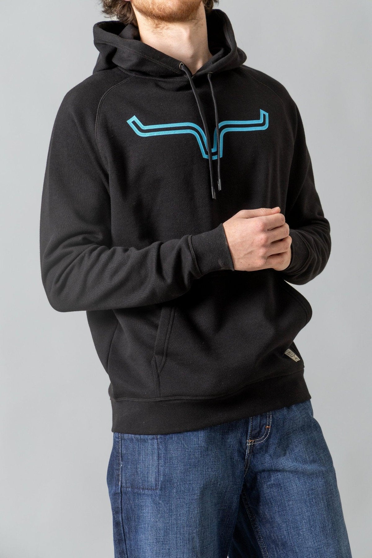 Kimes Ranch Outlier Hoodie in Black with a blue stylized steer logo on the chest and a front kangaroo pocket
