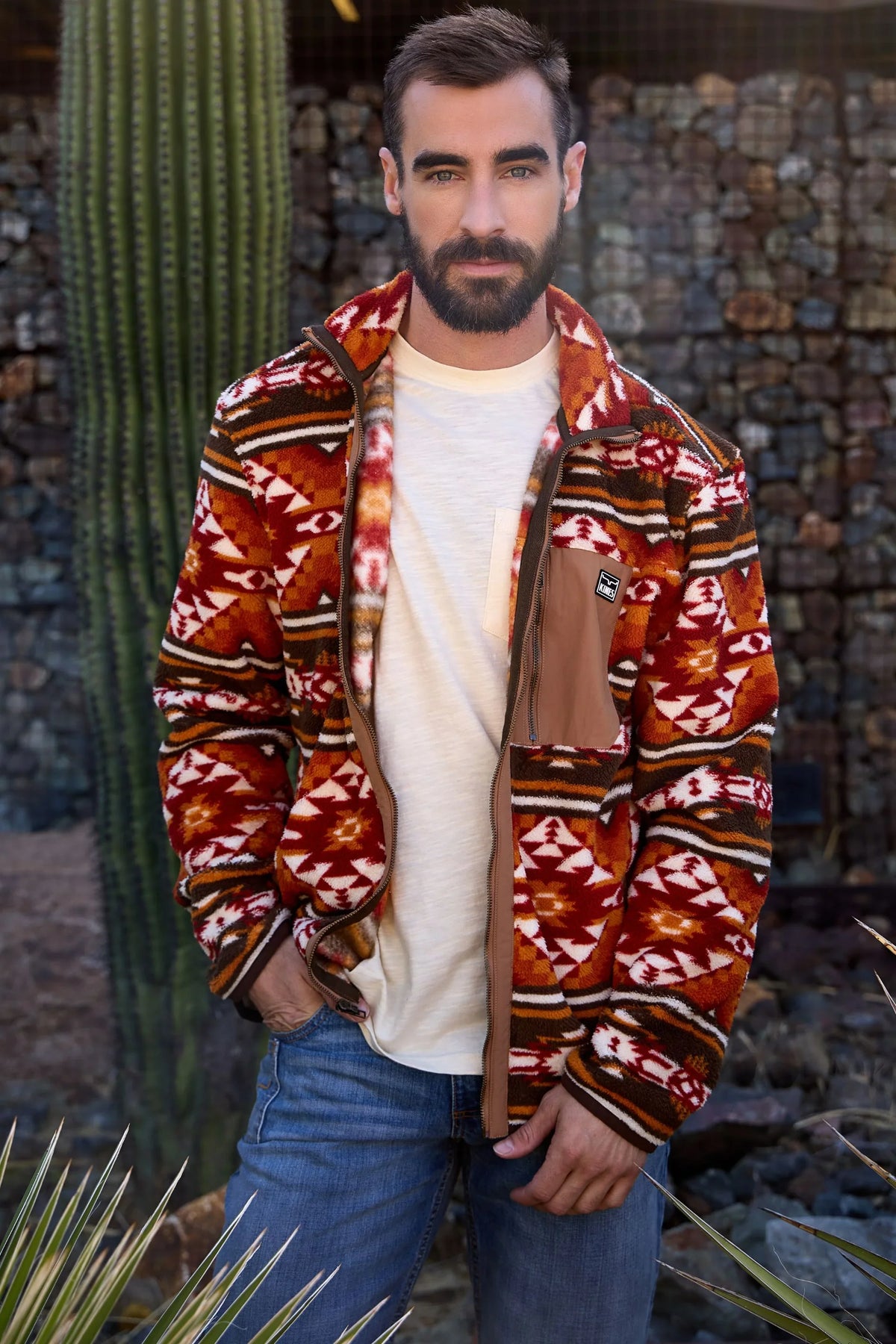 Kimes Ranch Mercury Fleece hoodie in red and brown with a geometric pattern and a brown chest pocket