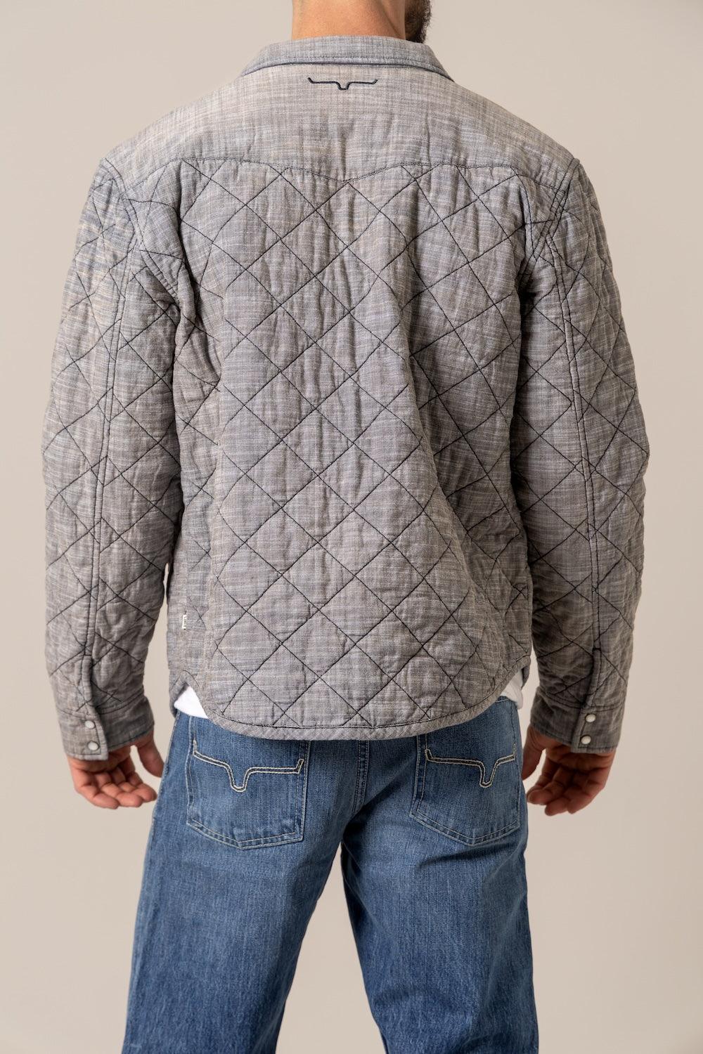 Kimes Ranch Westport Chambray, back view, jacket in grey with diamond quilting and the Kimes Ranch logo at the back yoke