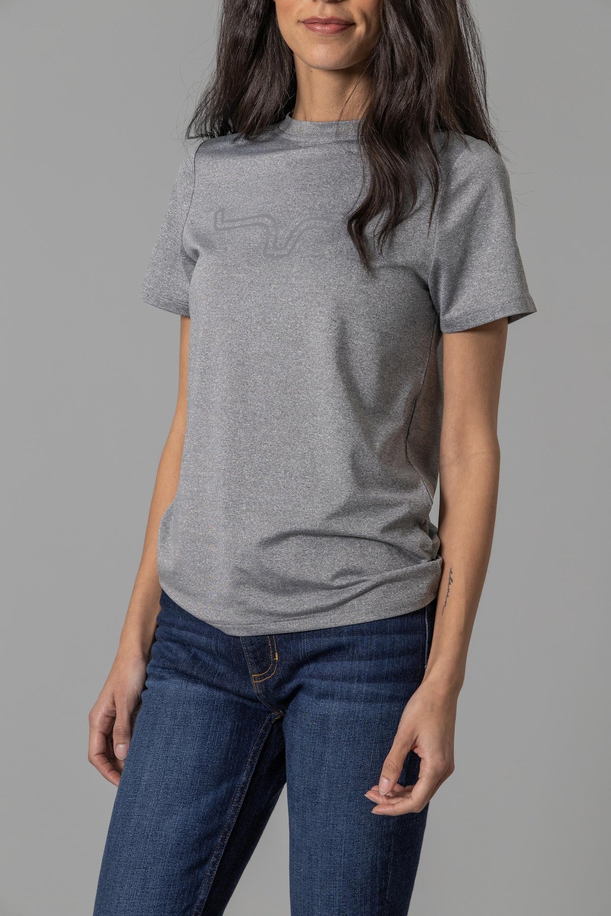 Kimes Ranch Ladies Outlier Tech Tee Shirt in Charcoal Heather with a tonal logo on the chest
