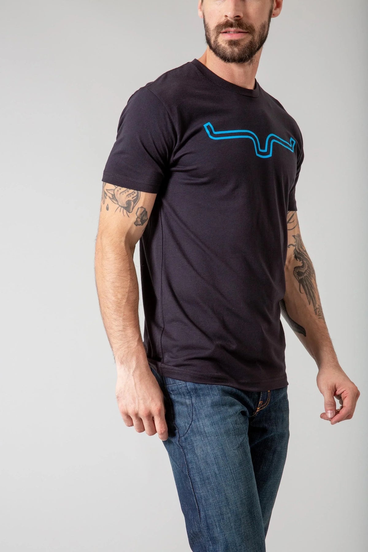 Kimes Ranch Outlier Shirt, side view, in black with a blue graphic print on the chest
