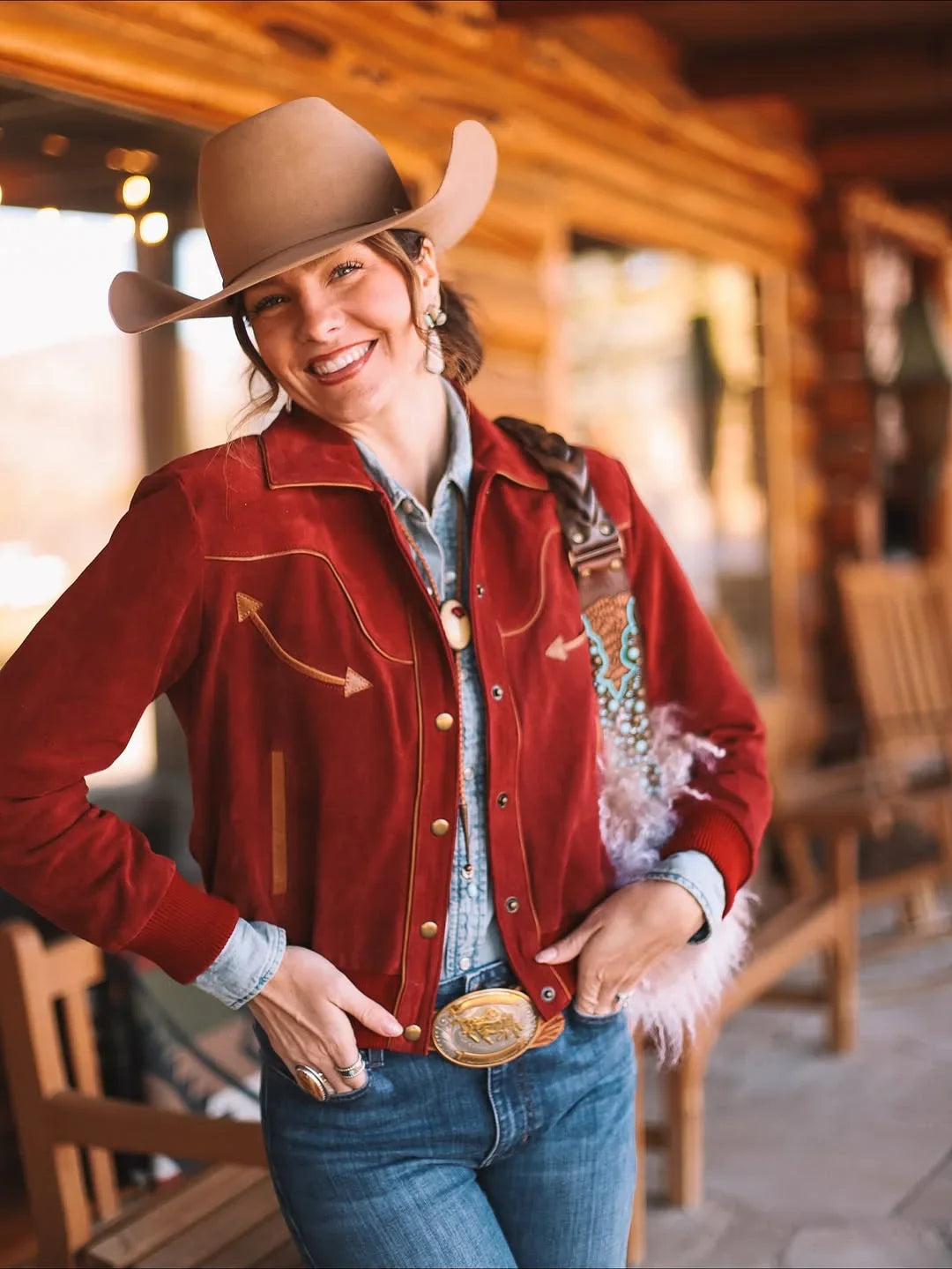 Kimes Ranch KR x Western & Co. Bomber Jacket in red with gold stitching and feather trim