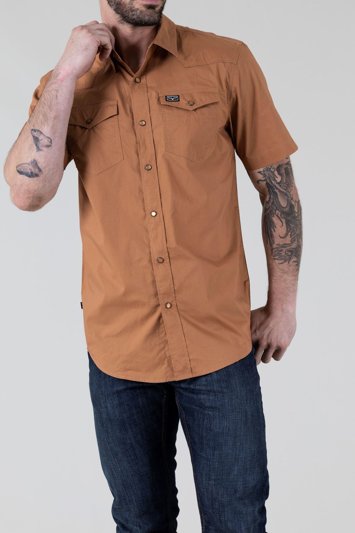 Kimes Ranch Rio Short Sleeve Dress Shirt in Work Wear Brown with two chest pockets and a logo patch