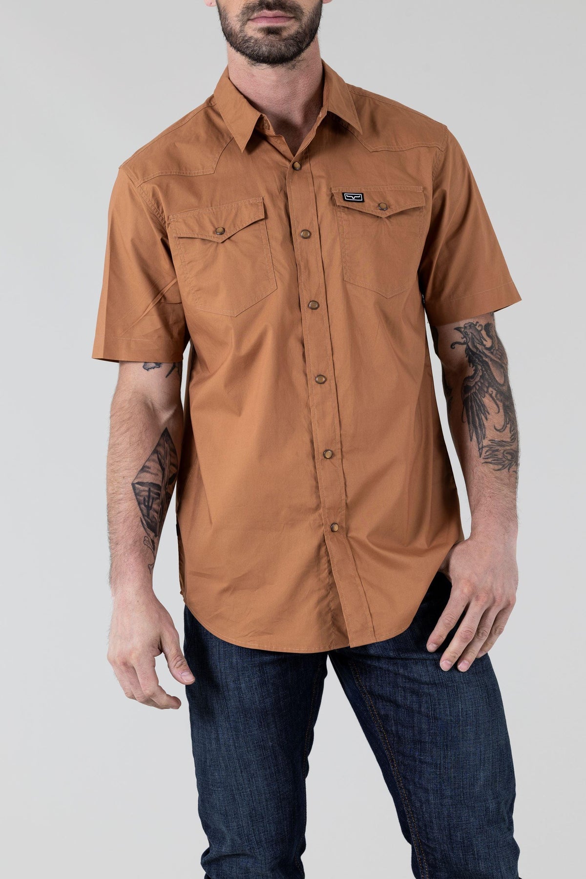 Kimes Ranch Rio Short Sleeve Dress Shirt in Work Wear Brown with chest pockets and a logo patch
