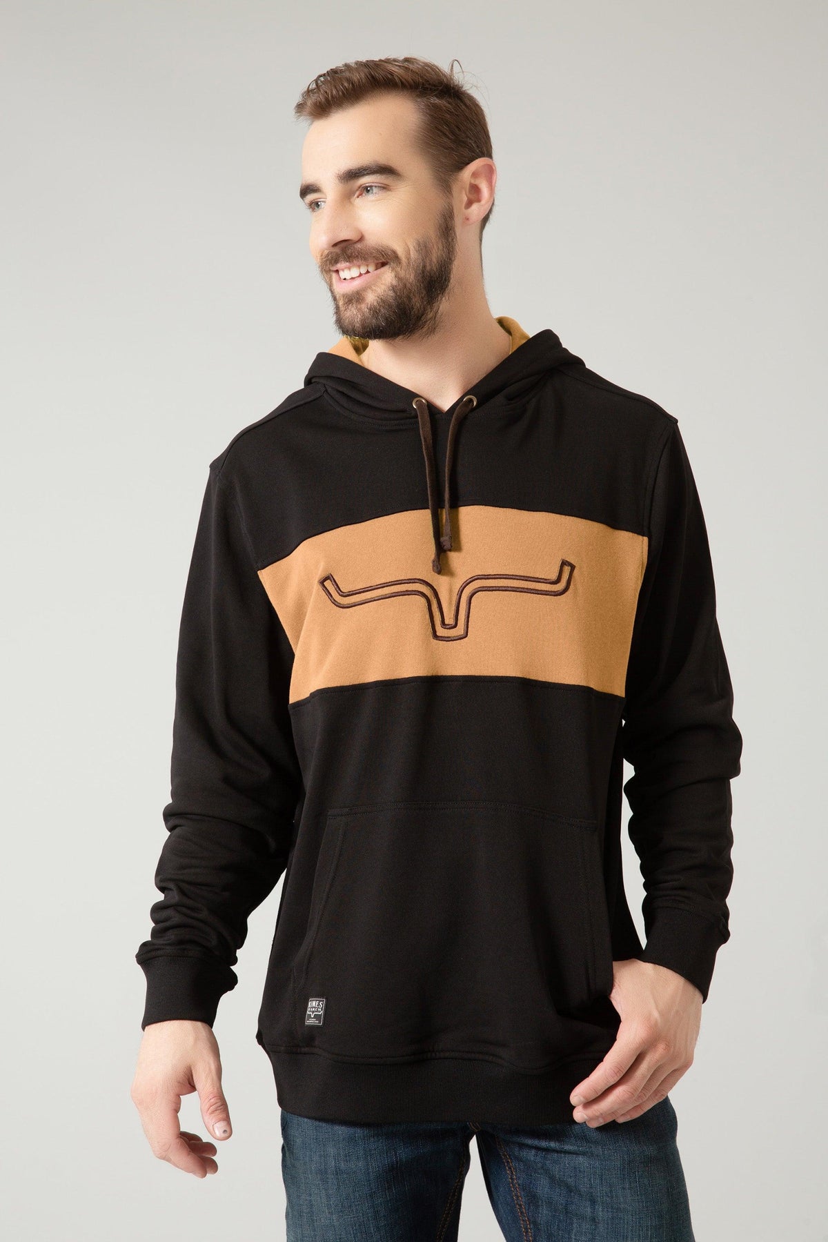 Kimes Ranch Ripon Hoodie in Black with a tan chest stripe and embroidered Kimes Ranch logo