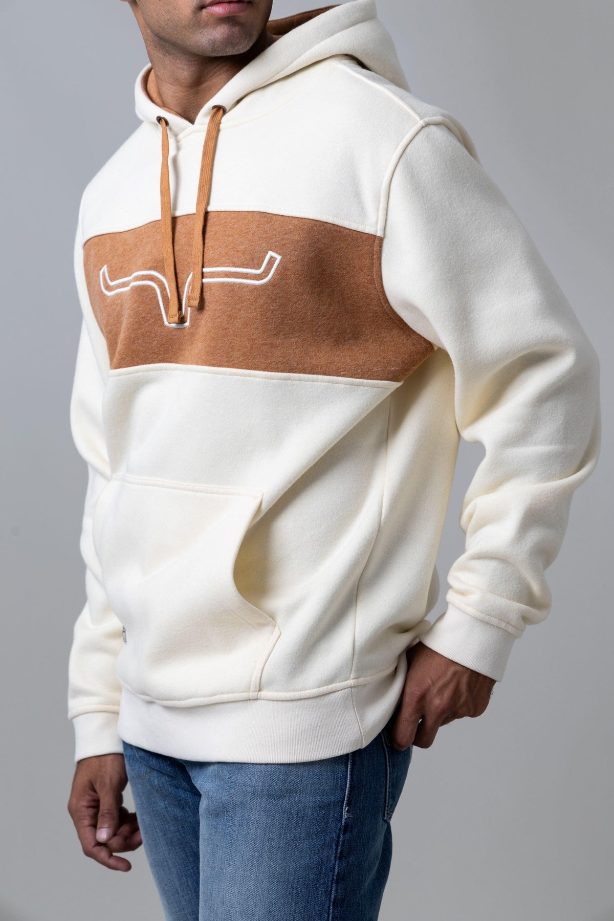 Kimes Ranch Ripon Hoodie in Natural, side view, with a brown chest panel and white Kimes Ranch logo