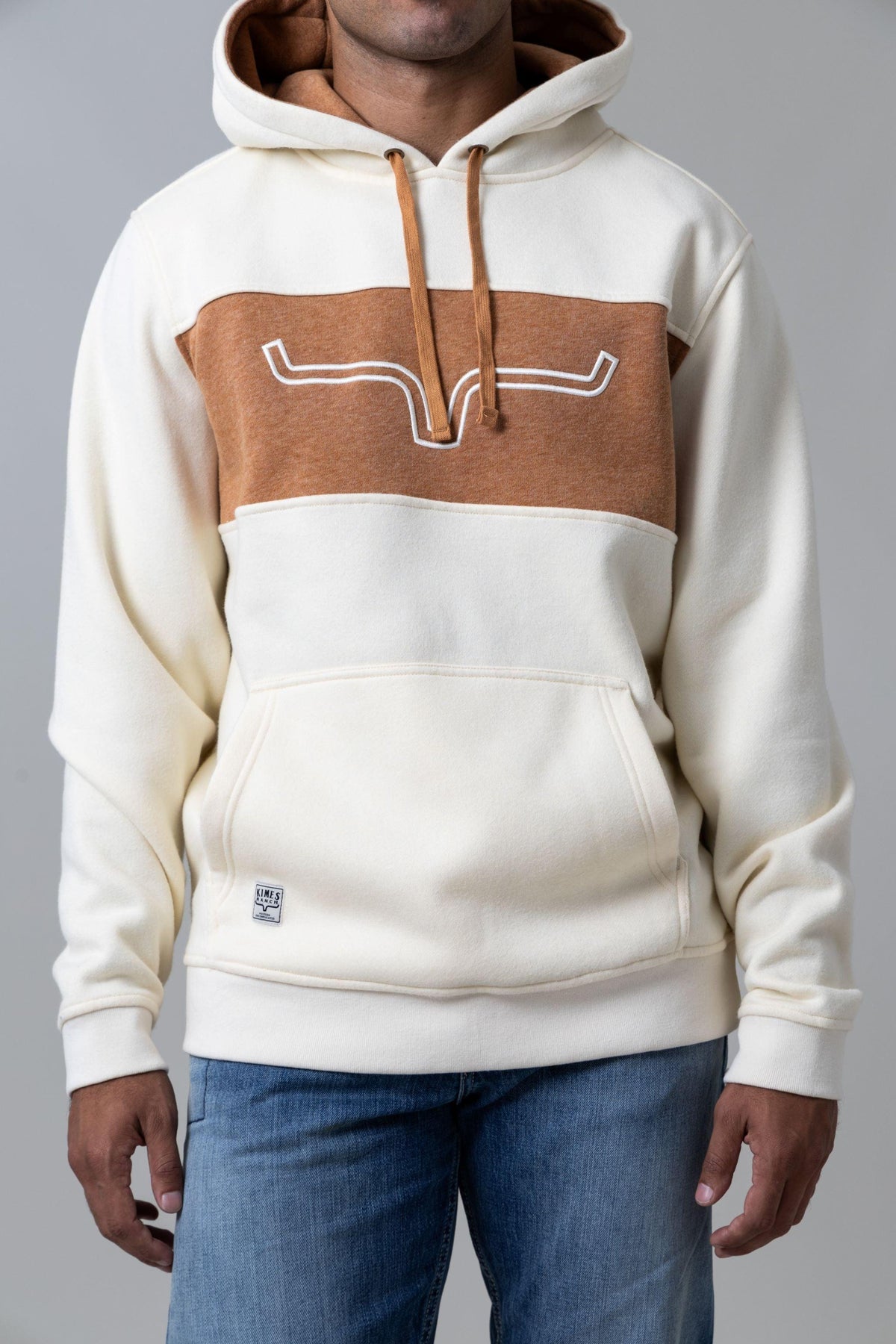 Kimes Ranch Ripon Hoodie in Natural with a tan chest panel and white Kimes Ranch logo