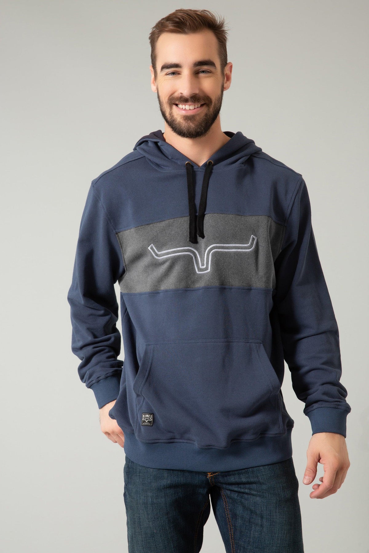 Kimes Ranch Ripon Hoodie in Navy with a grey chest panel and white logo outline