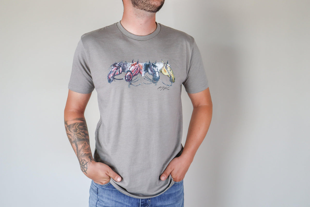 Kimes Ranch Randy Paul NRCHA Derby Tee Shirt in Grey with a graphic of four horses in red, blue, and yellow