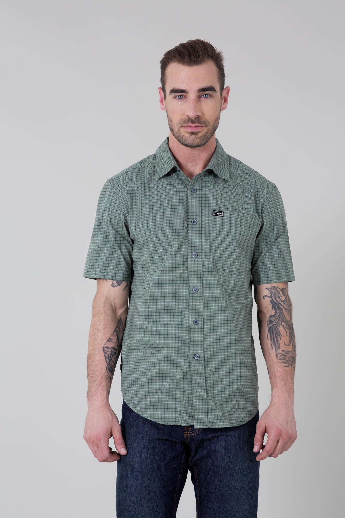 Kimes Ranch Spyglass Short Sleeve Dress Shirt in Sage with a subtle grid pattern and a chest logo