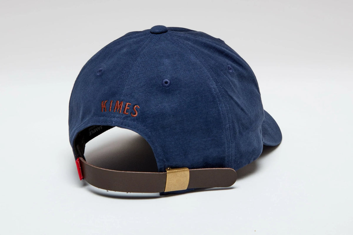 Kimes Ranch Vanguard Hat in Carbon Blue, back view, with embroidered KIMES text and brown strap