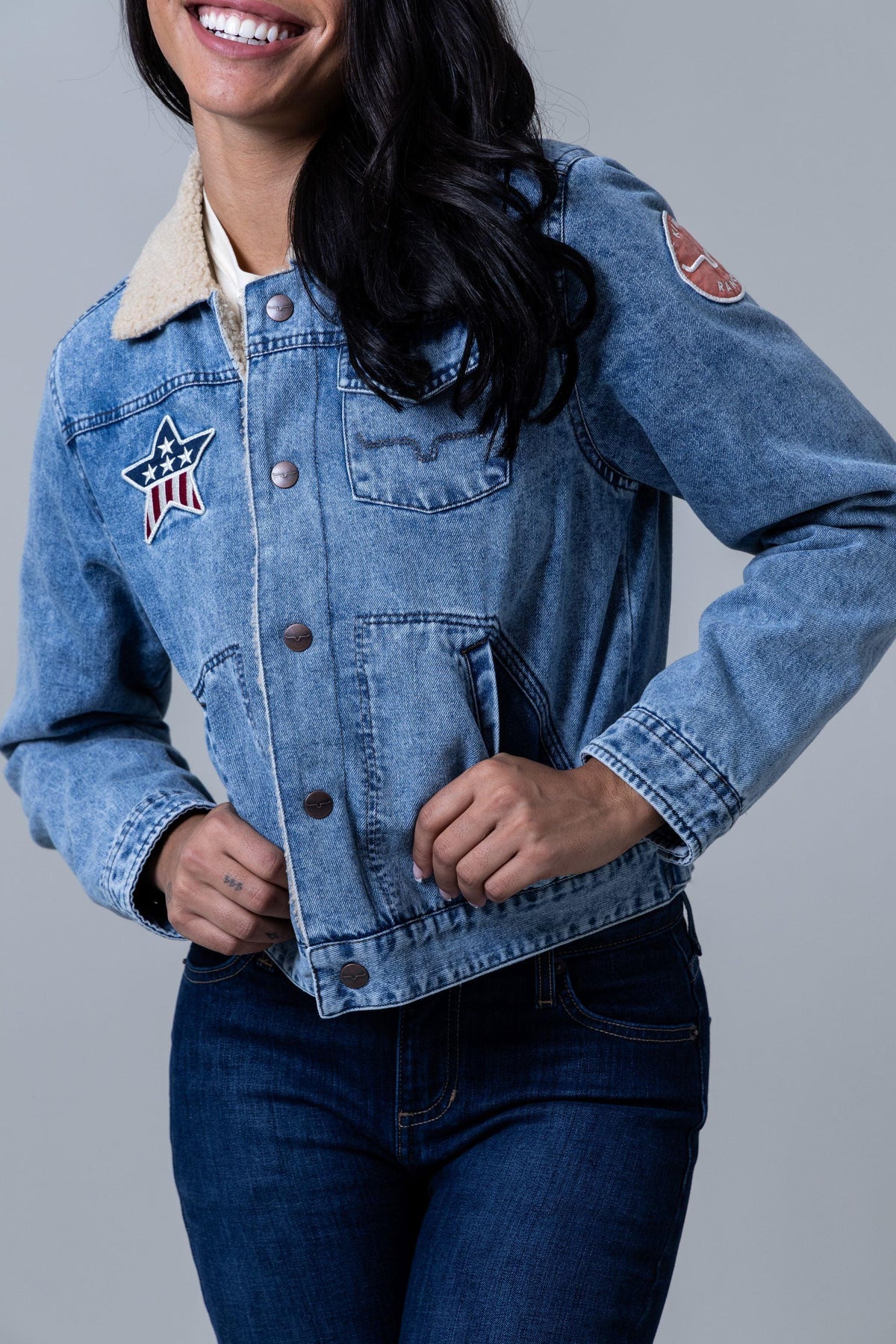 Kimes Ranch Vaquero Trucker jacket in Light Wash with a patriotic star patch and sherpa collar