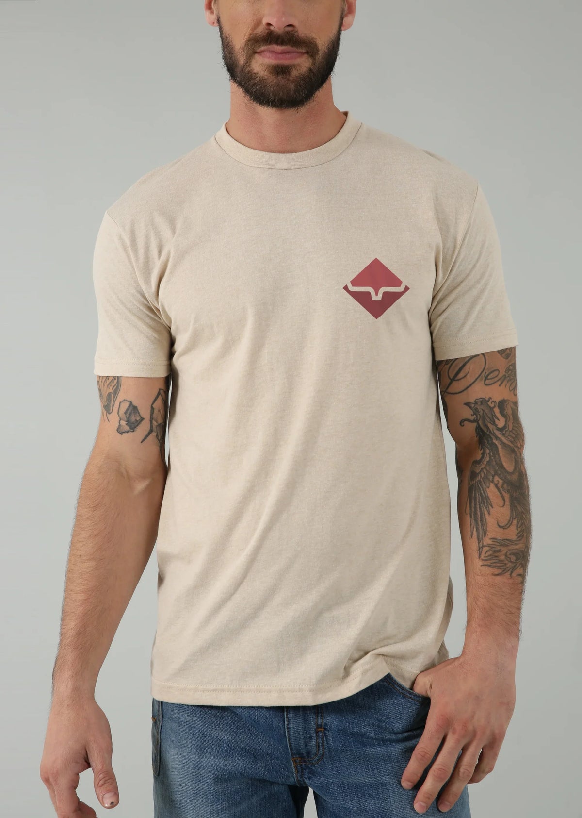 Kimes Ranch Warmth Shirt in Sand with a crew neck and short sleeves and a red logo on the chest