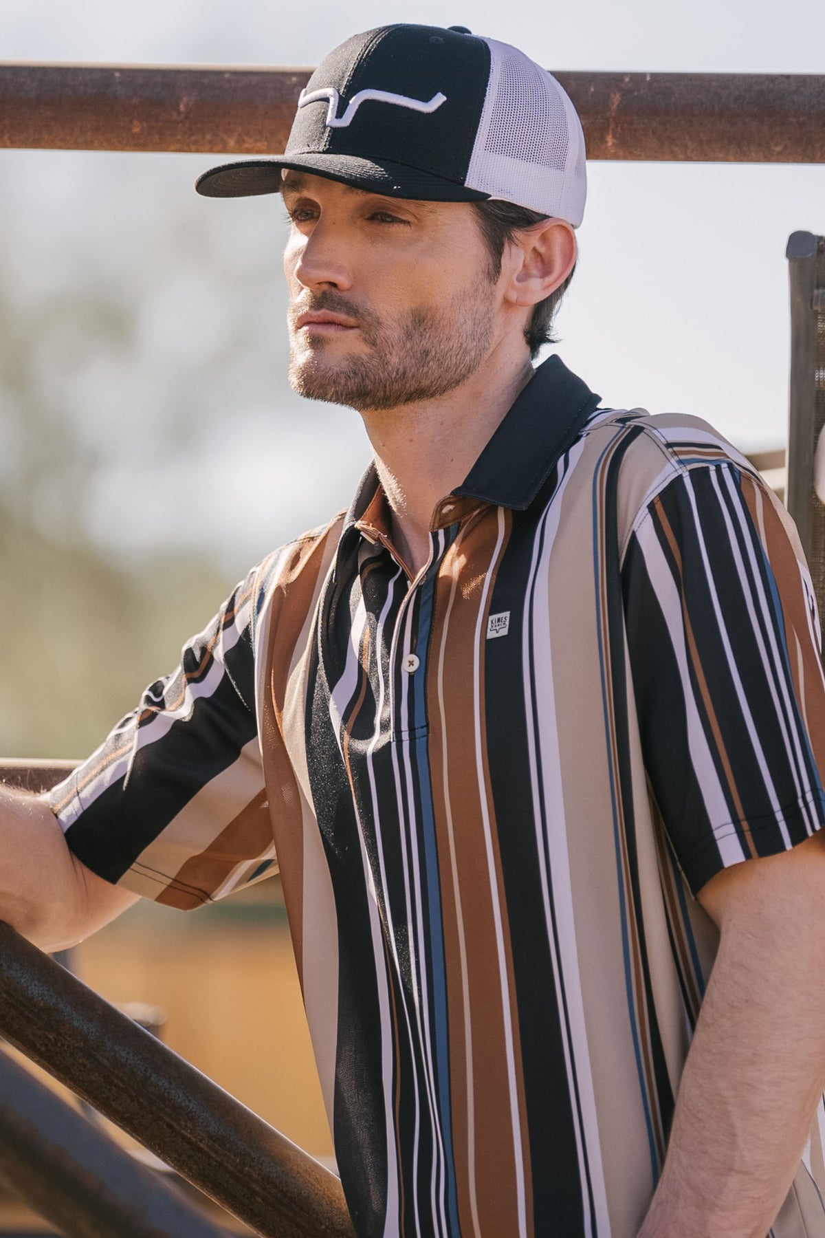 Kimes Ranch Rein polo in Black with brown and white vertical stripes and a solid Black collar