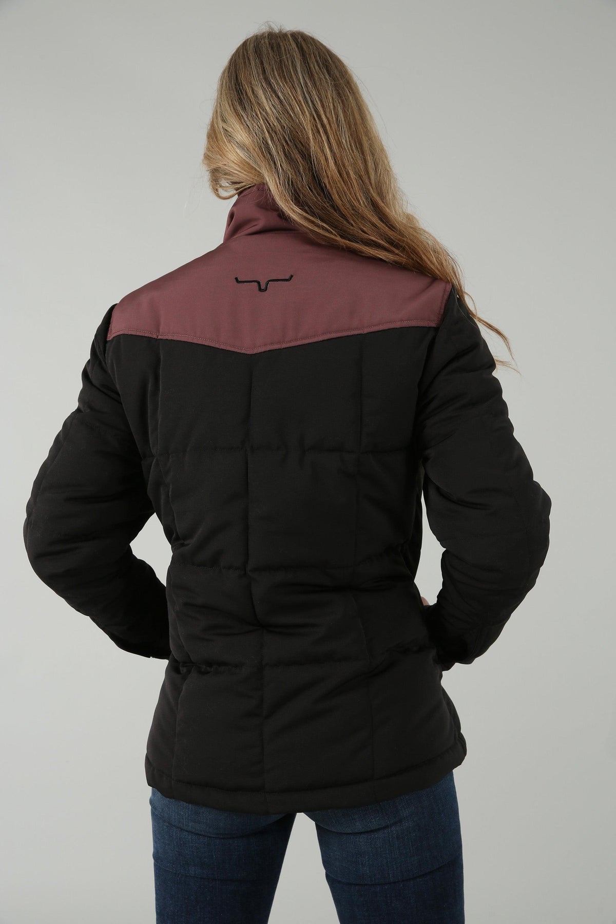 Kimes Ranch Wyldfire Jacket in Black, back view, with a burgundy yoke and Kimes Ranch logo