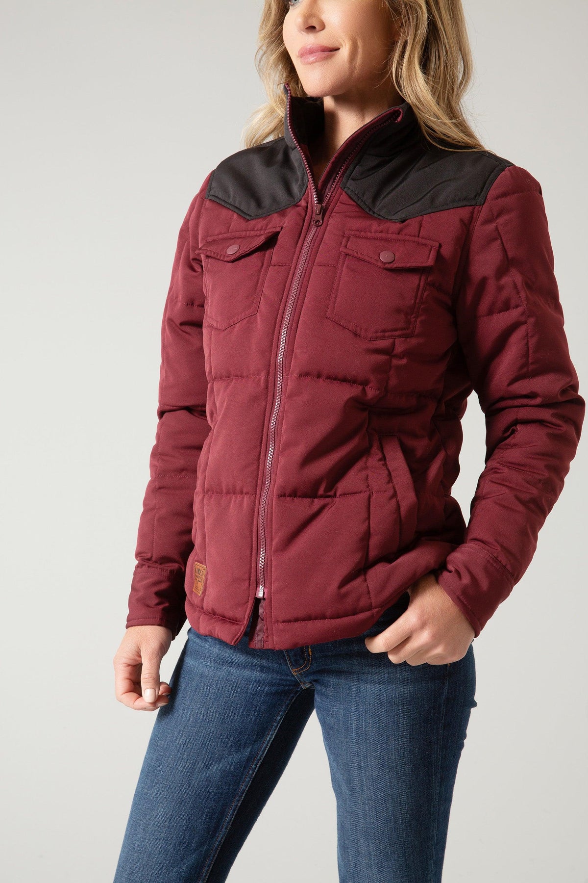 Kimes Ranch Wyldfire Jacket in Dark Wine with a black yoke, front pockets, and a logo patch