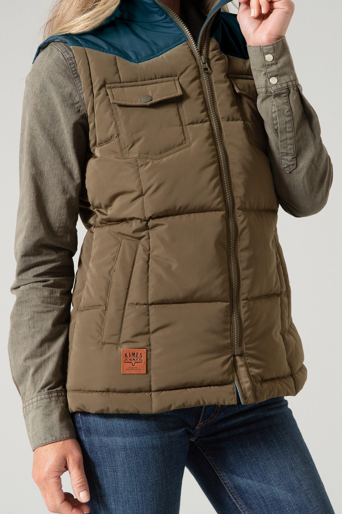 Kimes Ranch Wyldfire Vest in Army with quilted body, front flap pockets, and a teal collar