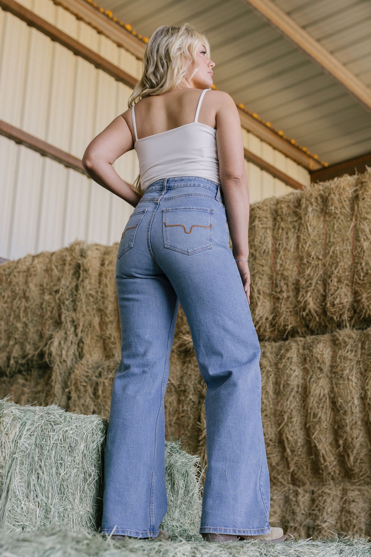 Kimes Ranch Zoey, back view, jeans in blue with a flared leg and back pockets