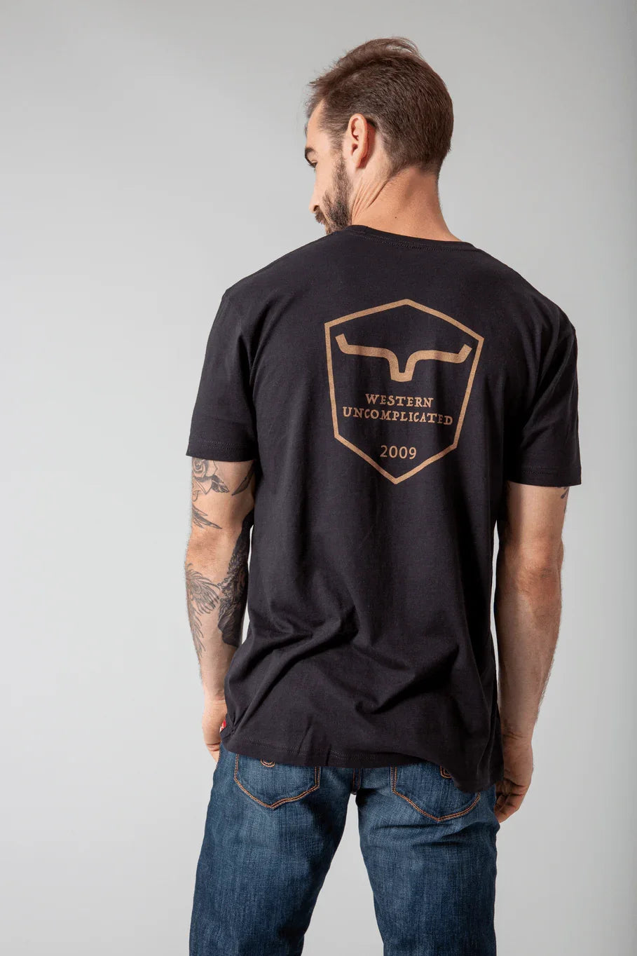 Kimes Ranch Shielded Trucker Shirt in Black, back view, with back graphic featuring the Kimes Ranch logo