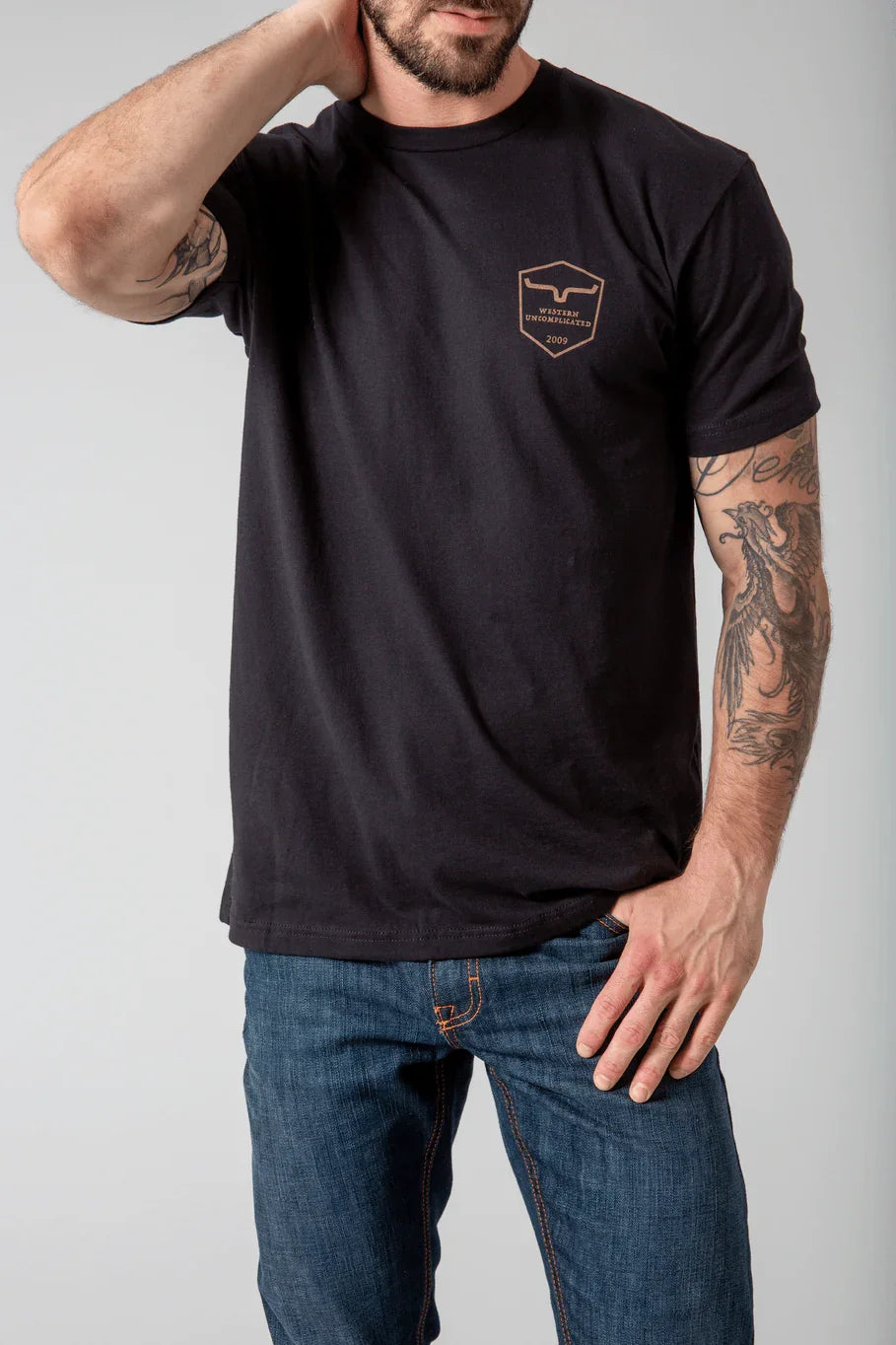 Kimes Ranch Shielded Trucker Shirt in black with a chest shield logo and short sleeves