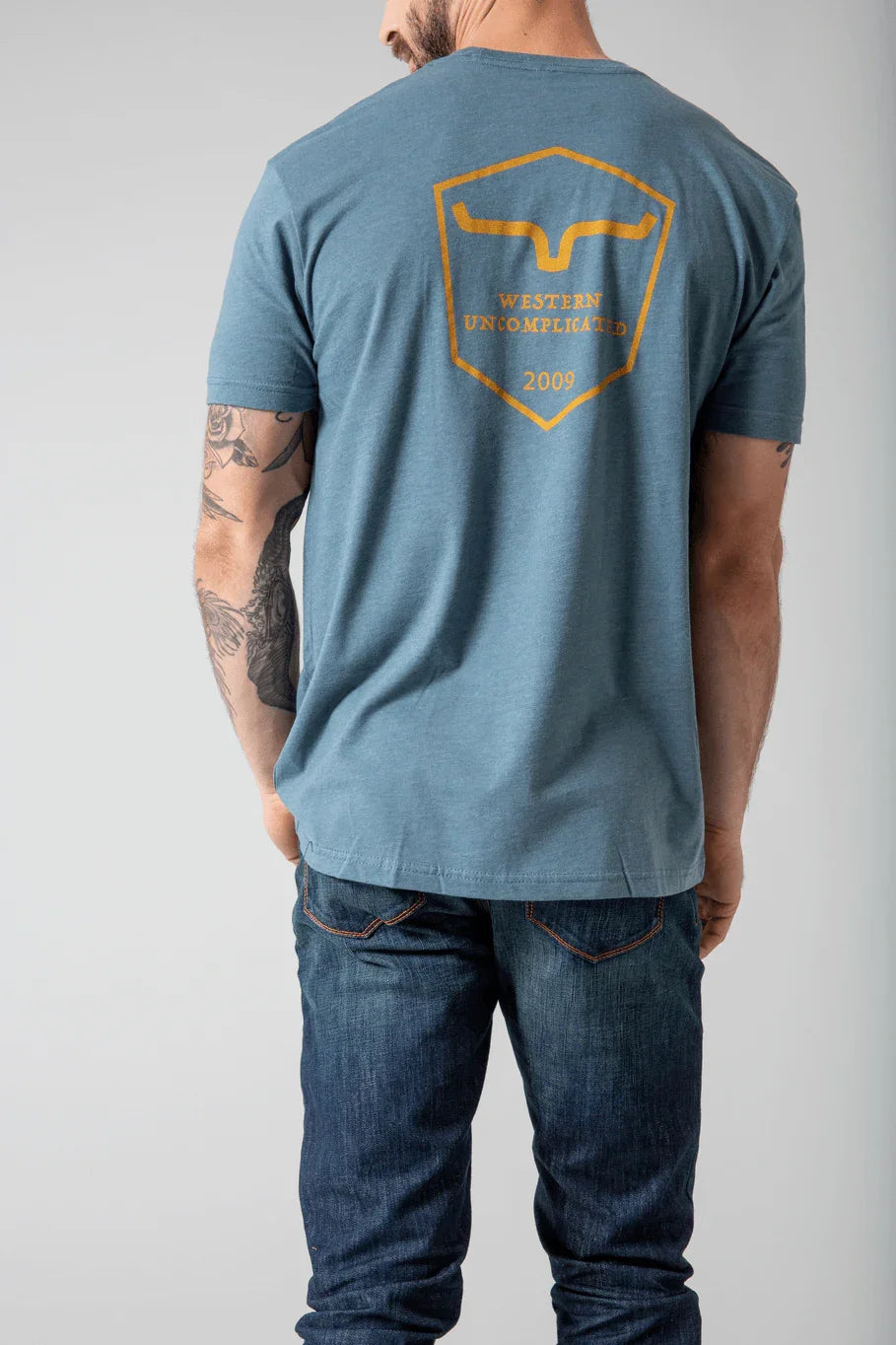 Kimes Ranch Shielded Trucker Shirt in Indigo, back view, with back graphic featuring the Kimes Ranch logo