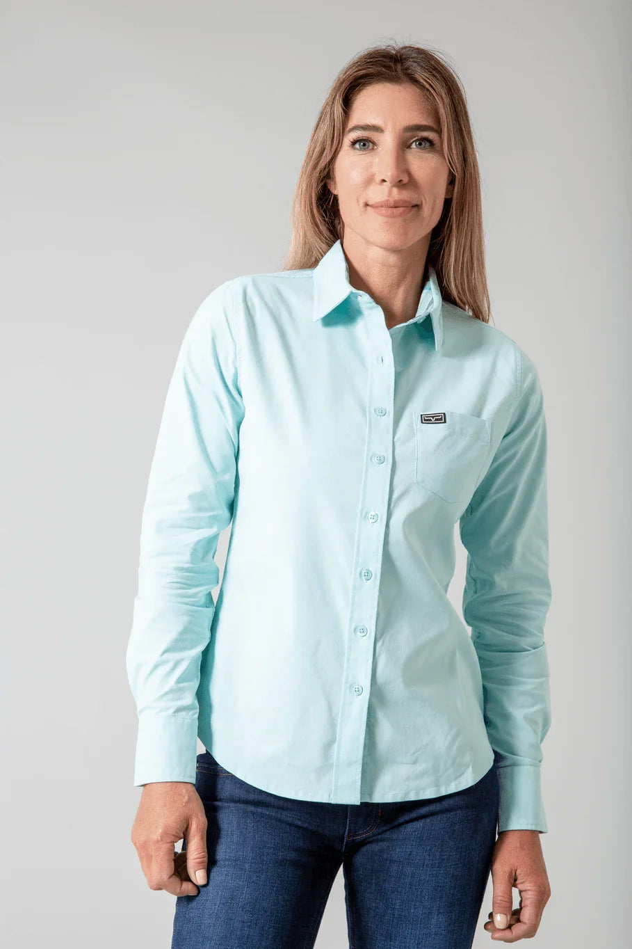 Kimes Ranch Ladies Linville top in Turquoise with long sleeves and a chest pocket with the Kimes Ranch logo