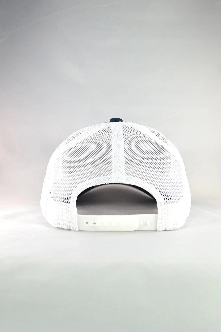 Kimes Ranch American Trucker Hat, back view, in white with Navy mesh back and adjustable snap closure