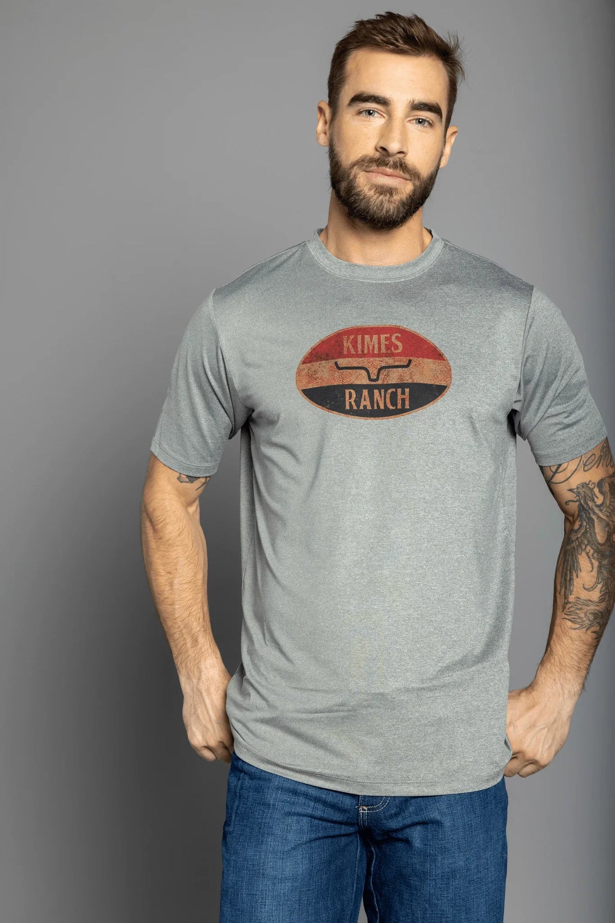 Kimes Ranch American Standard Tech T-Shirt in Athletic Grey Heather with a vintage oval Kimes Ranch logo on the chest
